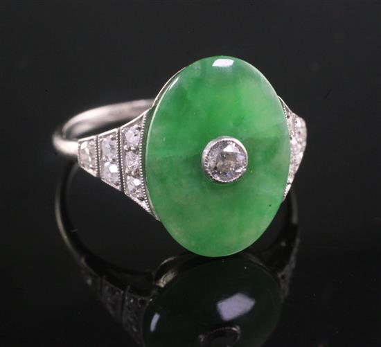 A 1920s style platinum, jadeite and diamond ring dress ring, size O.